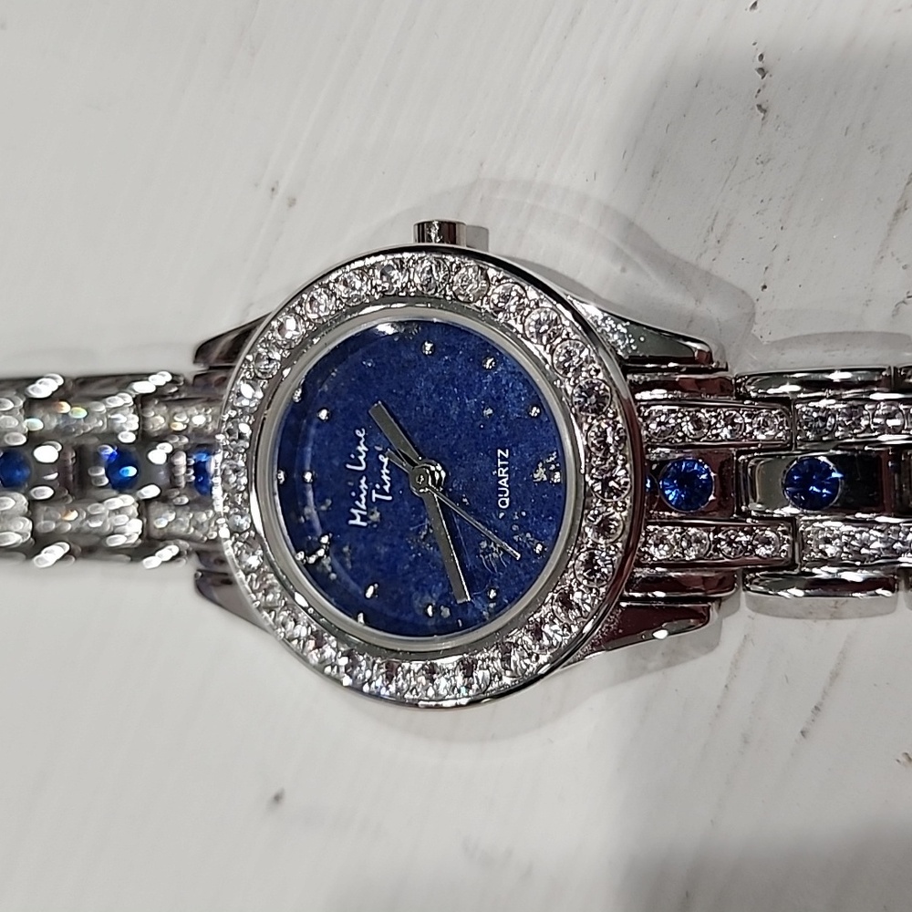 Beautiful silver colored watch w blue rhinestones